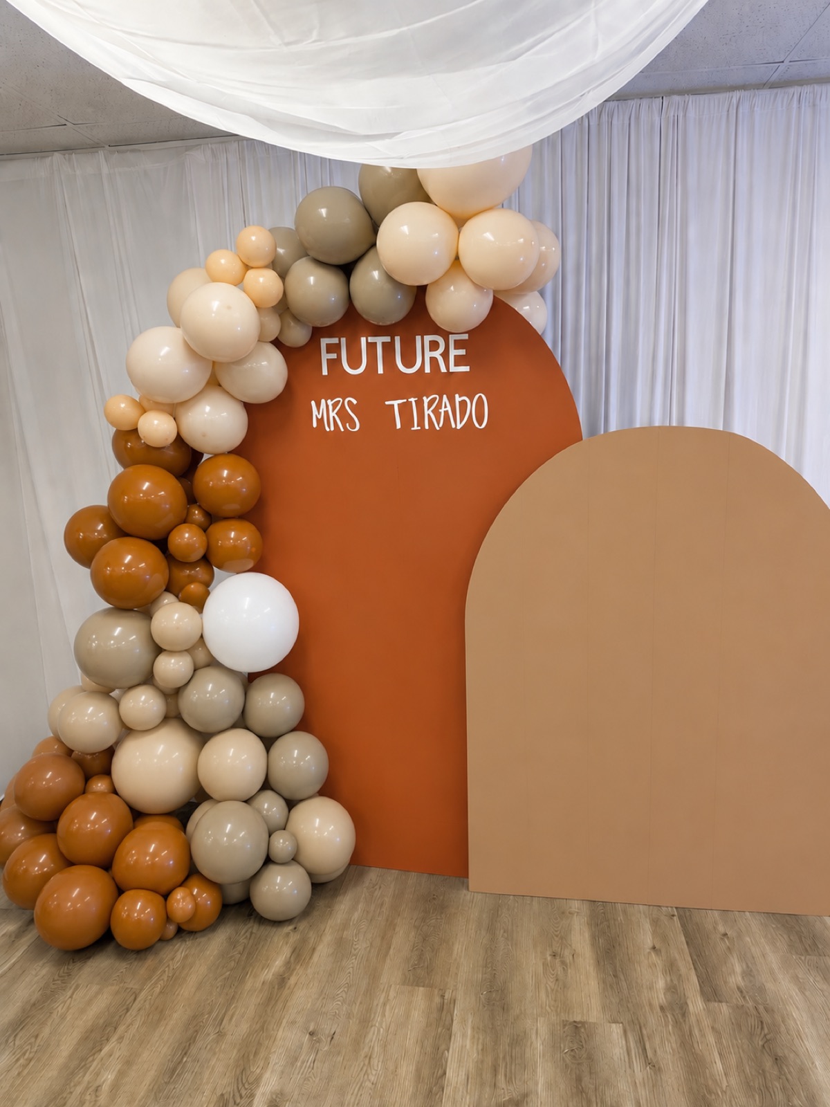 Terracotta balloon arch backdrop for a 'Future Mrs.' bridal shower